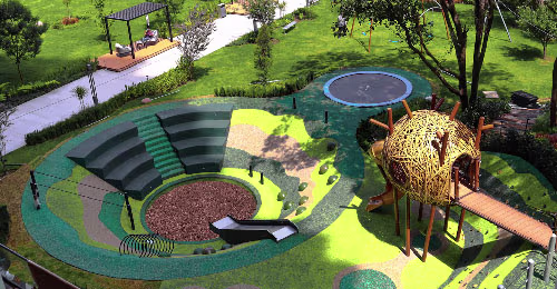 Aurea: A nature-inspired playground with climbing walls, a zip line, swings and a bamboo nest.
